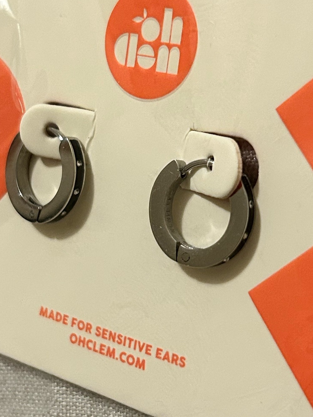 Oh Clem black dot Huggie Hoop Earrings in silver